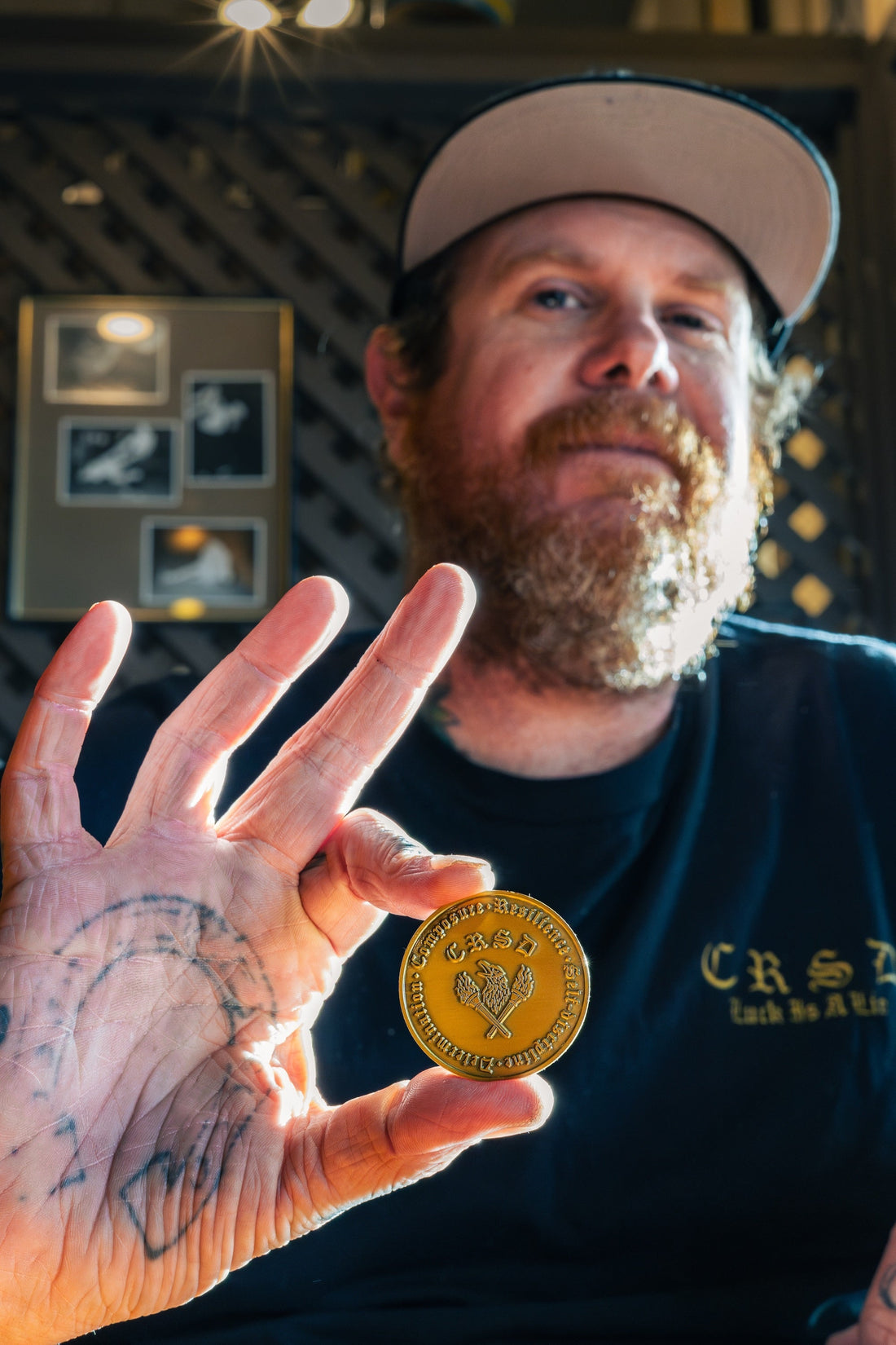 Josh Sneider holding the CRSD coin